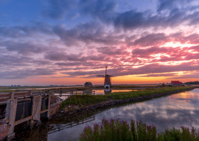 Andy Luberti zijn foto van een molen in het landschap van Texel