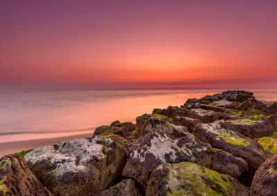 Pastelroze luchten boven de waddenzee foto gemaakt door landschapsfotograaf Andy Luberti